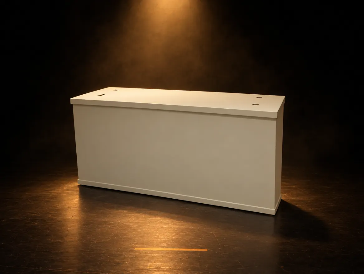 A cream wooden flower cart lit by a single warm spotlight on a dark floor